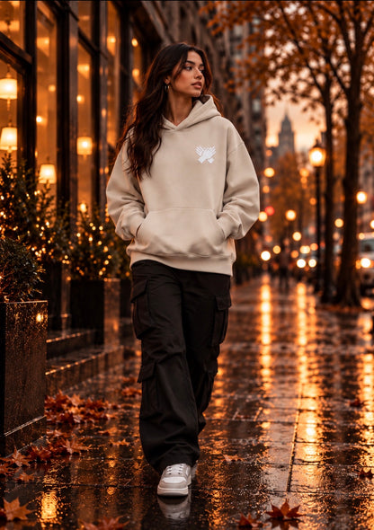 Female  Model wearing a bone cream oversized Nine N Half hoodie