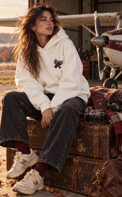     Woman styling NINE N HALF white heavyweight hoodie in fall travel setting
