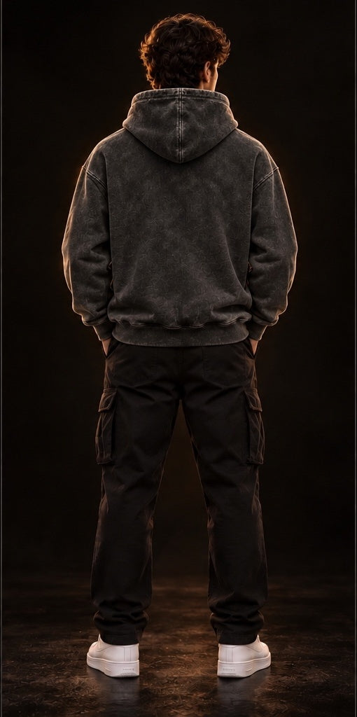 Model wearing a vintage black heavyweight hoodie, back view