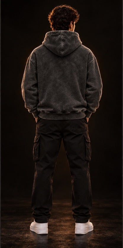 Model wearing a vintage black heavyweight hoodie, back view