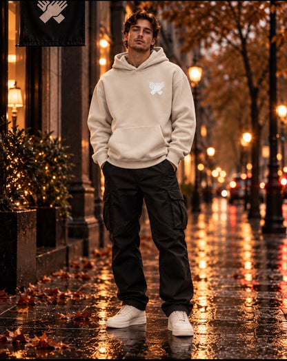     Model wearing a bone cream oversized Nine N Half hoodie